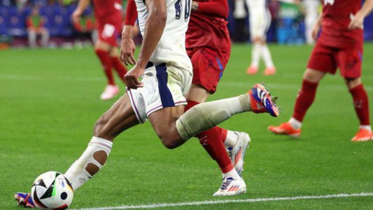 How to Wear Grip Socks with Football Socks (Complete Footballer’s Guide)